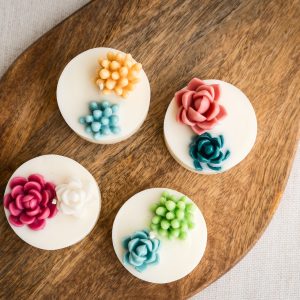 Vela aromática con suculentas